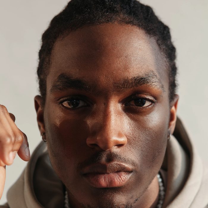 A young person photographed in warm natural light